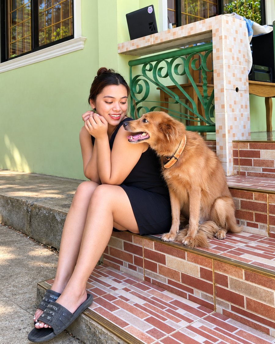 Perry of Bark Buddy sitting on the front steps with a golden dog, who comes to your free Meet and Greet