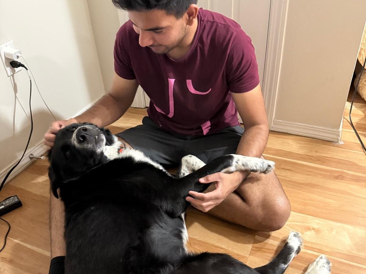 Parin of Bark Buddy getting to know a dog during a free Meet and Greet in Swift Current